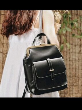 Structured Black Leather Backpack with Gold-Tone Frame